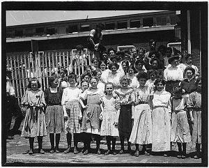 Group of girl workers at the gate of the American Tobacco Co. Young girls obviously under 14 years of age, who work about 10 hours every day except Saturday. Wilmington, Del., 05/1910