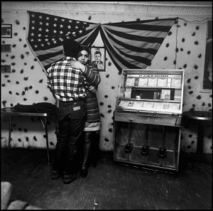 Bruce Davidson, COUPLE BY JUKEBOX IN SOCIAL CLUB, 1966, from the series East 100th Street
