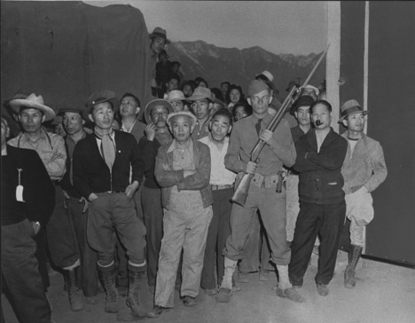 Japanese Internees and Guard "Greet" New Arrivals at Manzanar (War Relocation Authority)